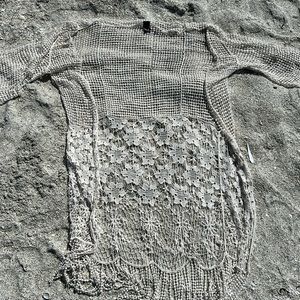 Off white kimono or bathing suit cover up.  Large whole in arm.  See pictures